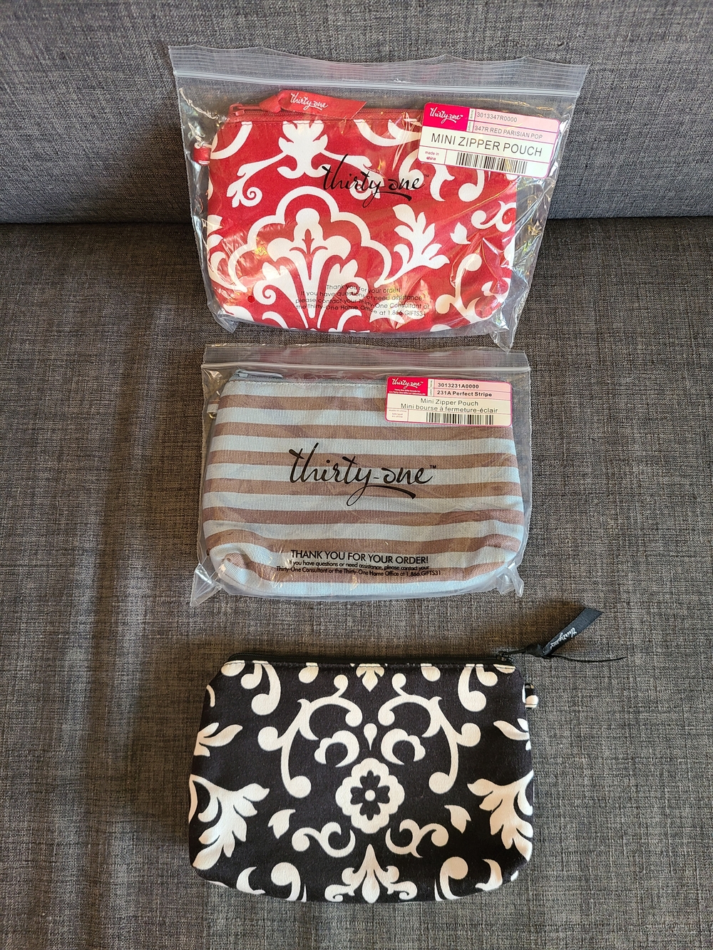 thirty-one Mini Zipper Pouches – Set of Three in Red, Blue/Brown, and Black